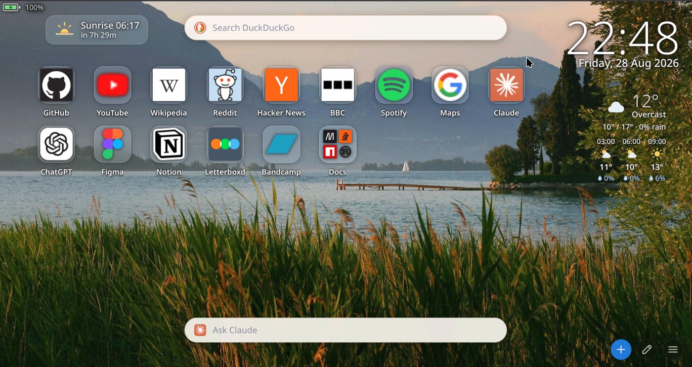 The new tab page: a grid of app tiles with real site icons over a lake wallpaper, with a search bar, clock, weather, a sunrise countdown and an Ask Claude bar.
