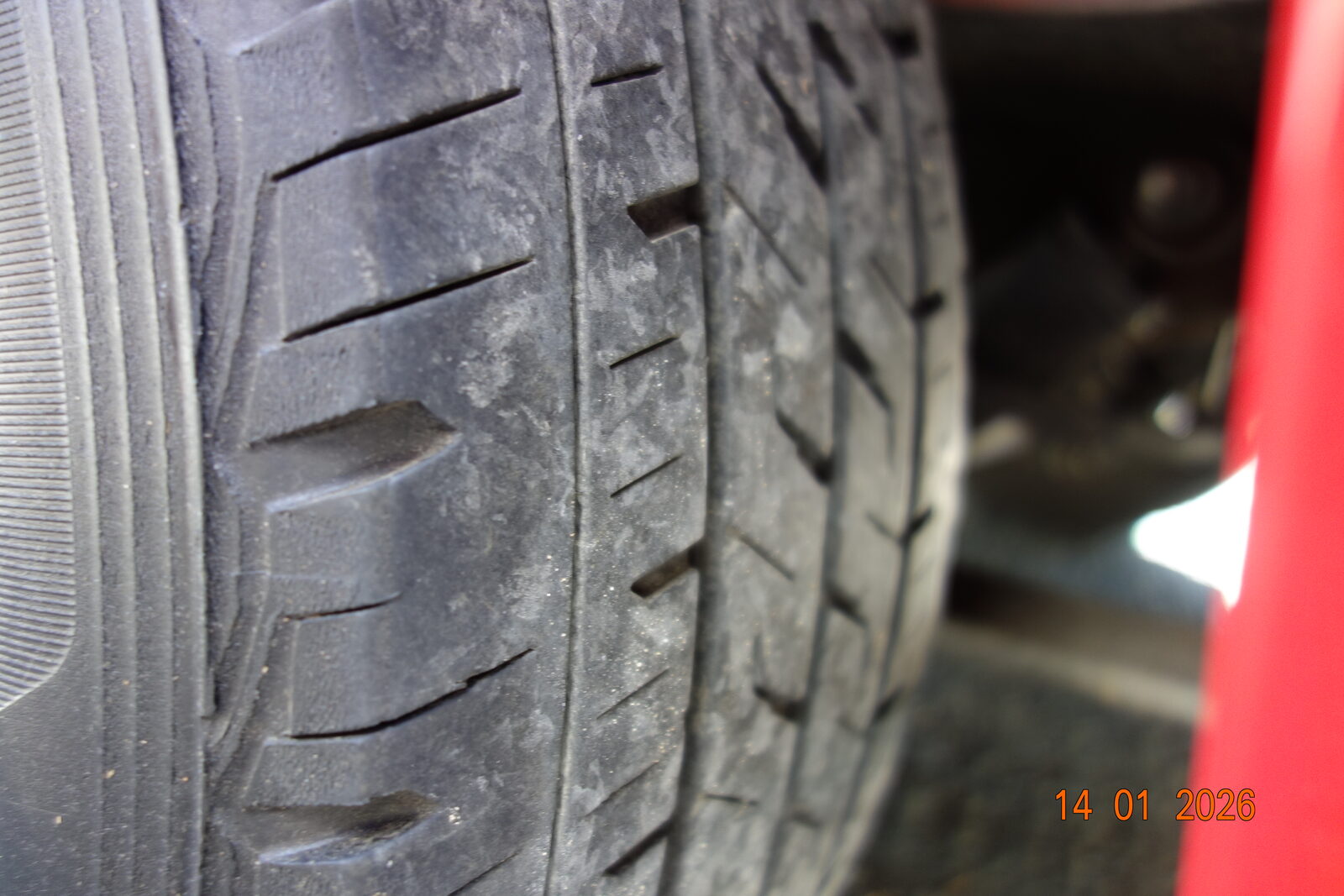 Close view of a tyre showing remaining tread depth